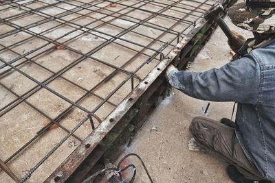 Low section of man working on construction site