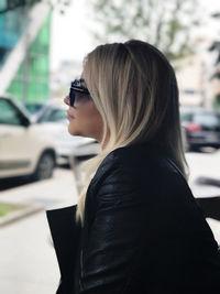 Side view of woman wearing sunglasses