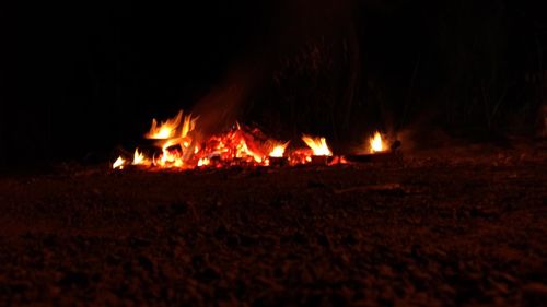 Bonfire on wooden structure at night