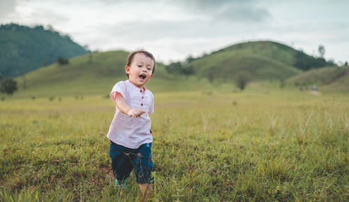 Boy standing on field
