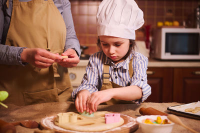 Portrait of boy preparing food at home