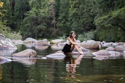 Woman sitting in a lake