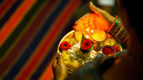 Close-up of hand holding christmas decorations