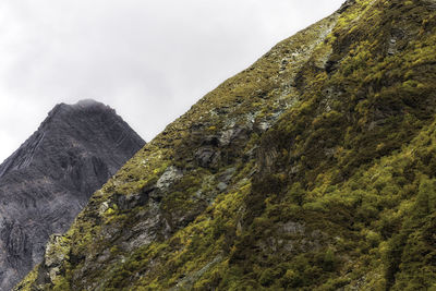 Low angle view of rock formations against sky