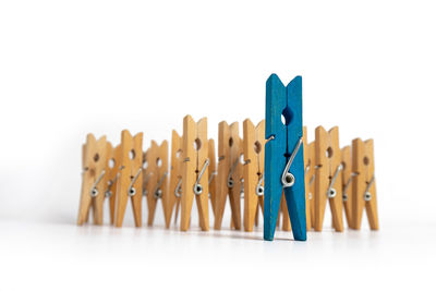 Close-up of clothespins against white background