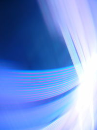 Close-up of blue light over white background