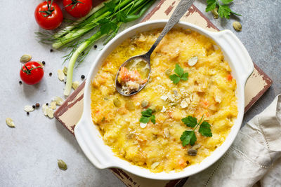 Homemade baked casserole crumble with red fish, white bread and cheese. proper nutrition. 