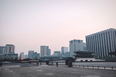 Skyscrapers in city against clear sky