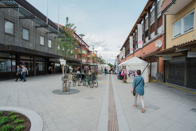 People walking on street in city