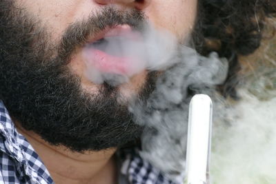 Close-up of man smoking