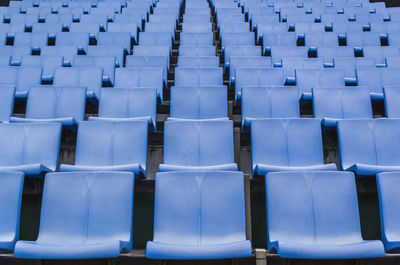 Full frame shot of blue empty chairs