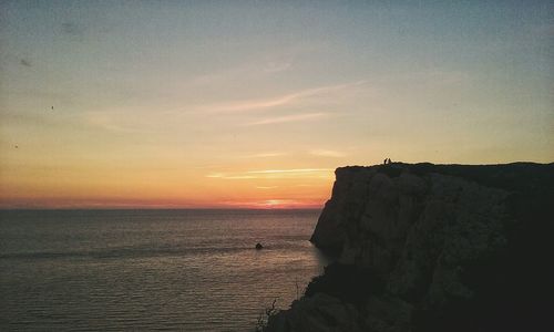 Scenic view of sea at sunset