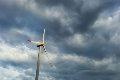 Low angle view of wind turbine against sky
