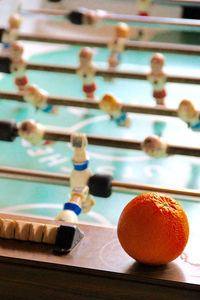 Close up of orange by foosball