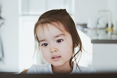 Close-up portrait of cute baby at home