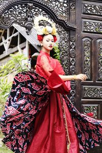 Full length of woman standing at temple