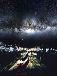 Road against sky at night