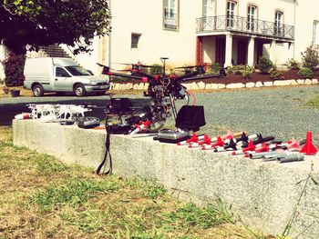 Cars on road by buildings in city