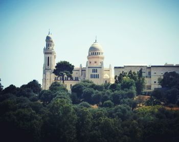 Low angle view of church against blue sky