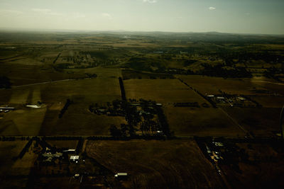 Aerial view of agricultural field against sky