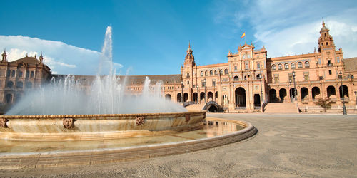 Panoramic view of fountain building against sky