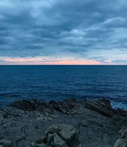 Scenic view of sea against sky at sunset