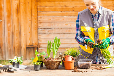 Woman gardening at shop