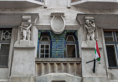 Low angle view of statues on building