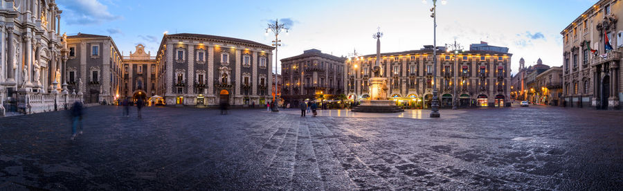 Piazza duomo and saint agatha cathedral panorama in catania medieval town, sicily, italy, at sunset