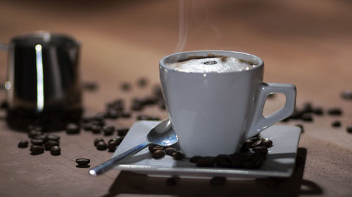 Close-up of coffee cup on table