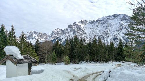 Scenic view of snowcapped mountains against sky