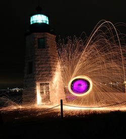 Light painting against sky at night