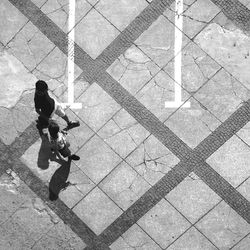 Woman standing on footpath