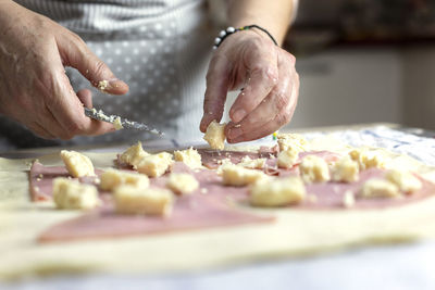 Midsection of person preparing food