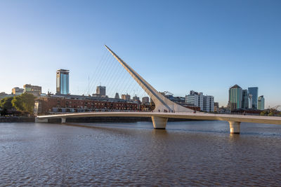 Bridge over river against clear sky