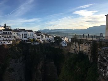 High angle view of buildings in town against sky