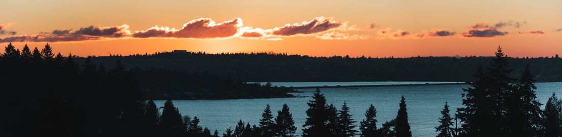 Scenic view of lake against romantic sky at sunset