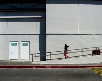 Woman standing by railing