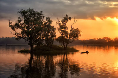 Scenic view of lake against sky during sunset