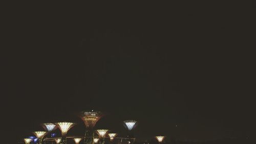 Low angle view of illuminated building against sky