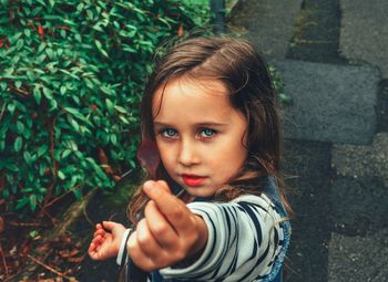 Portrait of girl holding outdoors