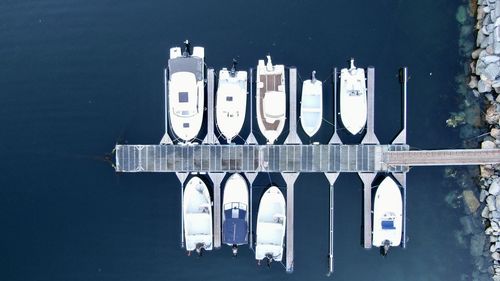 High angle view of boats in sea against building