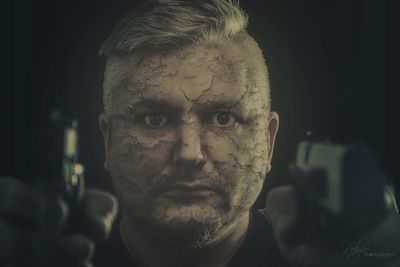Close-up portrait of man wearing mask
