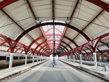 Rear view of man walking in tunnel