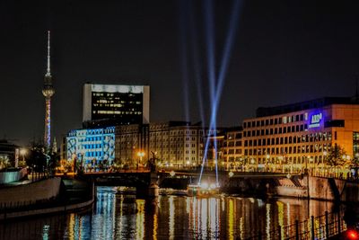 Illuminated buildings at waterfront