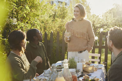 Friends having meal in garden