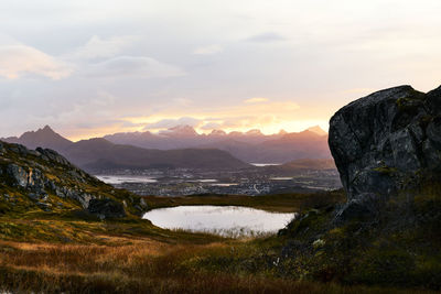 Scenic view of lake against sky during sunset