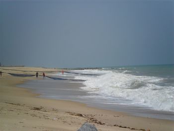 Scenic view of beach against clear sky