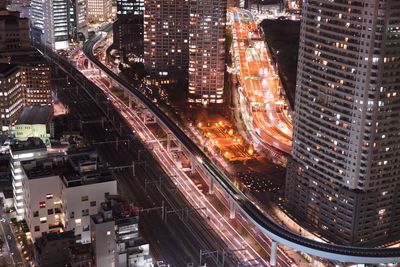 Aerial view of illuminated cityscape at night