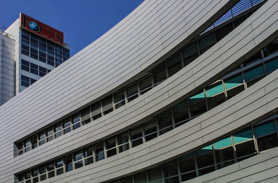 Low angle view of office building against sky